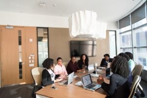 Law firm professionals reviewing marketing performance on a laptop