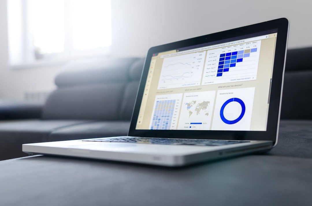 Laptop and printed charts used to review marketing and intake performance